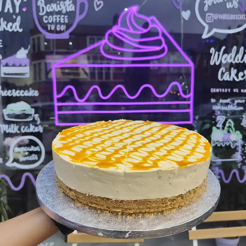 Caramel-drizzled cheesecake with a graham cracker crust.