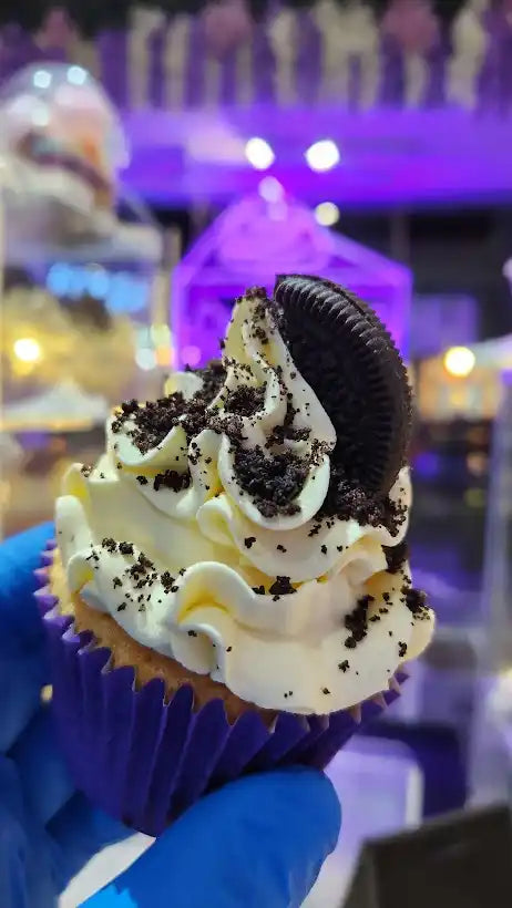 Oreo cupcake with white frosting.