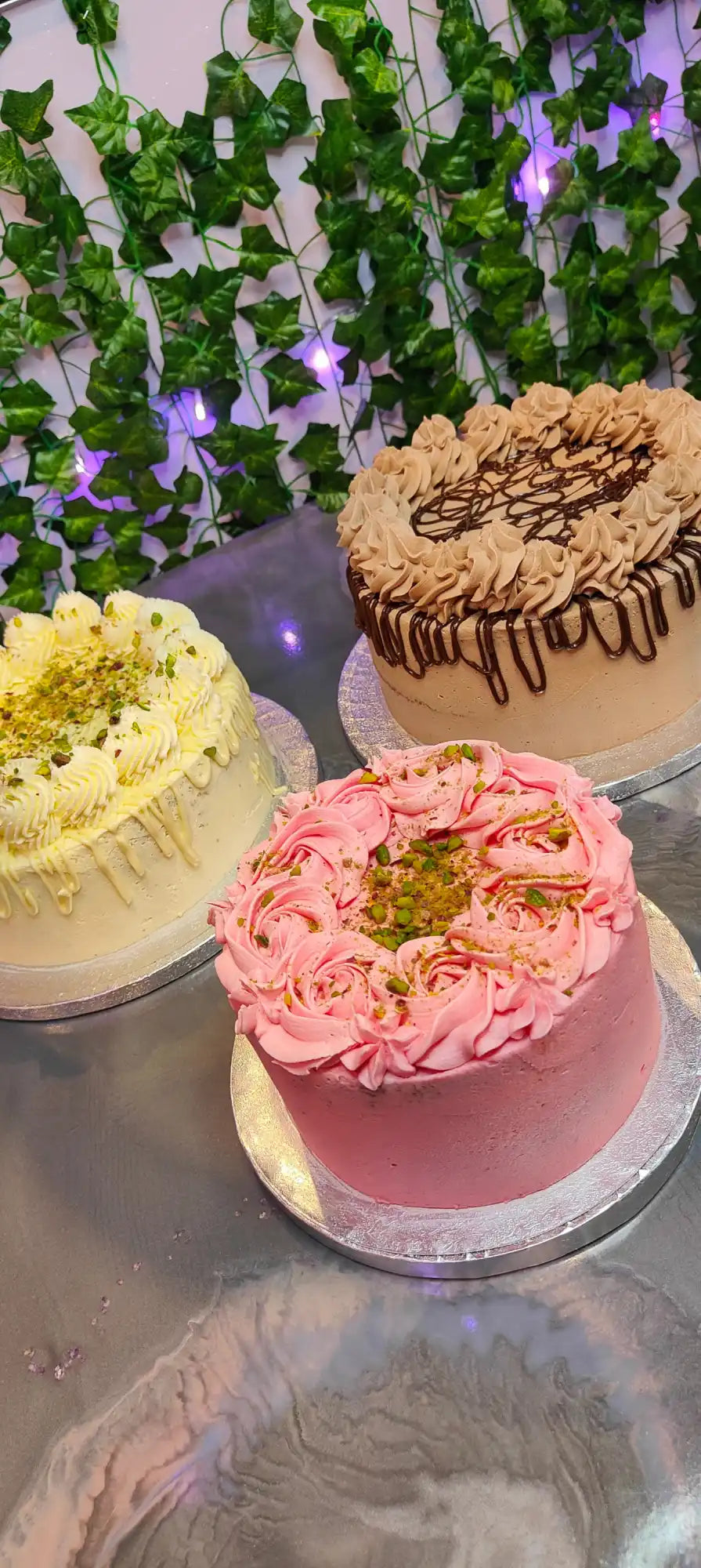 Three frosted cakes.