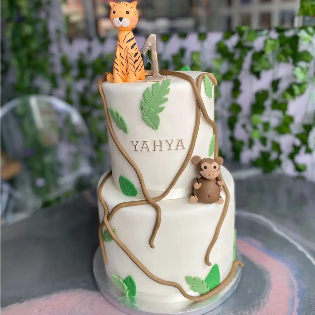 Two-tiered jungle-themed birthday cake.